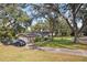 Home with large lot, mature trees, two-car garage at 1614 King James Ct, Lakeland, FL 33813