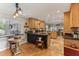 Open concept kitchen with island, granite countertops, and stainless steel appliances at 1614 King James Ct, Lakeland, FL 33813