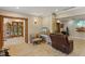 Bright living room with hardwood floors, comfy seating, and access to an outdoor patio at 1614 King James Ct, Lakeland, FL 33813
