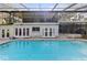 Relaxing screened pool area with house view at 1614 King James Ct, Lakeland, FL 33813