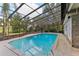 Inviting screened pool with a spacious deck at 1614 King James Ct, Lakeland, FL 33813