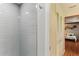 Updated shower with gray subway tile and a modern shower head at 1614 King James Ct, Lakeland, FL 33813