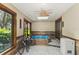Relaxing sunroom featuring a built-in hot tub and plenty of natural light at 1614 King James Ct, Lakeland, FL 33813