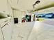 Spacious garage with ample storage, epoxy floor, and workbench at 1901 Basenji Dr, Lake Alfred, FL 33850