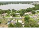 Aerial view showcases home's location near a lake and surrounding neighborhood at 415 Avenue K Ne, Winter Haven, FL 33881
