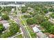 Aerial view highlights the home's location near the lake and surrounding landscape at 415 Avenue K Ne, Winter Haven, FL 33881