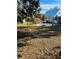 Spacious backyard with a large grassy area and mature trees at 415 Avenue K Ne, Winter Haven, FL 33881