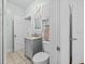 This bathroom is equipped with a marble vanity and a tiled floor at 415 Avenue K Ne, Winter Haven, FL 33881