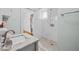 Updated bathroom with new vanity, granite countertop, and modern glass shower at 415 Avenue K Ne, Winter Haven, FL 33881