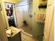Bathroom with a walk-in shower and updated vanity at 415 Avenue K Ne, Winter Haven, FL 33881