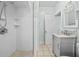 Renovated bathroom featuring walk-in shower, gray vanity, and updated fixtures at 415 Avenue K Ne, Winter Haven, FL 33881