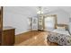 Bedroom boasts a bed, storage space, and a ceiling fan at 415 Avenue K Ne, Winter Haven, FL 33881