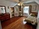 Charming bedroom with hardwood floors and en-suite bathroom at 415 Avenue K Ne, Winter Haven, FL 33881