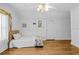 Simple bedroom with twin bed and hardwood floors at 415 Avenue K Ne, Winter Haven, FL 33881