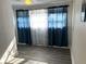 Bright bedroom with hardwood floors and large windows at 415 Avenue K Ne, Winter Haven, FL 33881