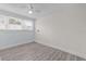 Small empty room features wood-look vinyl flooring and a window at 415 Avenue K Ne, Winter Haven, FL 33881