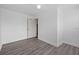 Unfurnished room offers neutral walls and vinyl flooring at 415 Avenue K Ne, Winter Haven, FL 33881