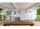 The property includes a carport and storage area, with brick pavers and a wooden bench at 415 Avenue K Ne, Winter Haven, FL 33881