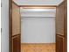 Closet with bifold doors, tiled floor, and closet rod at 415 Avenue K Ne, Winter Haven, FL 33881