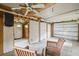 Spacious unfinished garage with wood chairs, room for storage, and potential for customization at 415 Avenue K Ne, Winter Haven, FL 33881