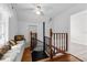 Second floor hallway featuring a small window bench with pillows at 415 Avenue K Ne, Winter Haven, FL 33881
