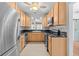 Modern kitchen featuring stainless steel appliances, and bright cabinetry at 415 Avenue K Ne, Winter Haven, FL 33881