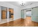 Bright space showing the kitchen view, with sliding barn door, and hardwood floors at 415 Avenue K Ne, Winter Haven, FL 33881