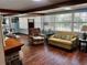 Living room features hardwood floors, a fireplace, and ample natural light at 415 Avenue K Ne, Winter Haven, FL 33881