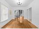 Open living area featuring hardwood floors and a view of the spiral staircase at 415 Avenue K Ne, Winter Haven, FL 33881