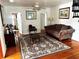 Living room featuring hardwood floors and a comfy couch at 415 Avenue K Ne, Winter Haven, FL 33881