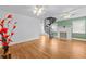 Bright living room with a spiral staircase, fireplace, and hardwood floors at 415 Avenue K Ne, Winter Haven, FL 33881