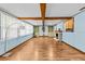 Bright living room features exposed beams, fireplace, and built in shelving at 415 Avenue K Ne, Winter Haven, FL 33881