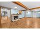 Spacious living room features a stone fireplace and hardwood floors at 415 Avenue K Ne, Winter Haven, FL 33881