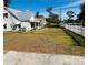 House with a large side yard and a white picket fence at 415 Avenue K Ne, Winter Haven, FL 33881