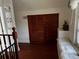 Upper level features built-in wooden cabinets and a window seat at 415 Avenue K Ne, Winter Haven, FL 33881