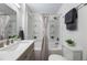 Updated bathroom with a tub, toilet and modern vanity at 521 W Voorhis Ave, Deland, FL 32720