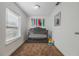 Charming Bedroom featuring a crib and playful decor at 521 W Voorhis Ave, Deland, FL 32720