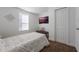 Bedroom with a twin bed and a bench at the foot of the bed at 521 W Voorhis Ave, Deland, FL 32720