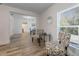 Bright dining area with glass top table and patterned chairs at 521 W Voorhis Ave, Deland, FL 32720