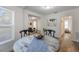 Dining room features a round table, chairs, and hardwood floors at 521 W Voorhis Ave, Deland, FL 32720