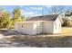 House exterior showcasing side view and backyard at 521 W Voorhis Ave, Deland, FL 32720
