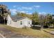 House exterior with newly painted walls and landscaping at 521 W Voorhis Ave, Deland, FL 32720