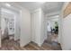 Hallway with bathroom, linen closet, and view into dining area at 521 W Voorhis Ave, Deland, FL 32720
