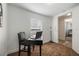 Home office with desk and chair, next to bedroom at 521 W Voorhis Ave, Deland, FL 32720