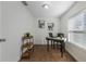 Home office with desk, chair, and three-tiered shelf at 521 W Voorhis Ave, Deland, FL 32720