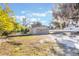 View of tan house exterior from the backyard at 521 W Voorhis Ave, Deland, FL 32720
