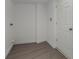 Bright laundry room with vinyl flooring and a door at 521 W Voorhis Ave, Deland, FL 32720