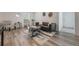 Modern living room with black leather sofa and stylish decor at 521 W Voorhis Ave, Deland, FL 32720