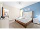 Spacious bedroom with king-size bed, TV, and ensuite bathroom access at 601 Drop Shot Dr, Davenport, FL 33896