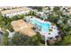 Relaxing community pool with lounge chairs and cabanas at 601 Drop Shot Dr, Davenport, FL 33896